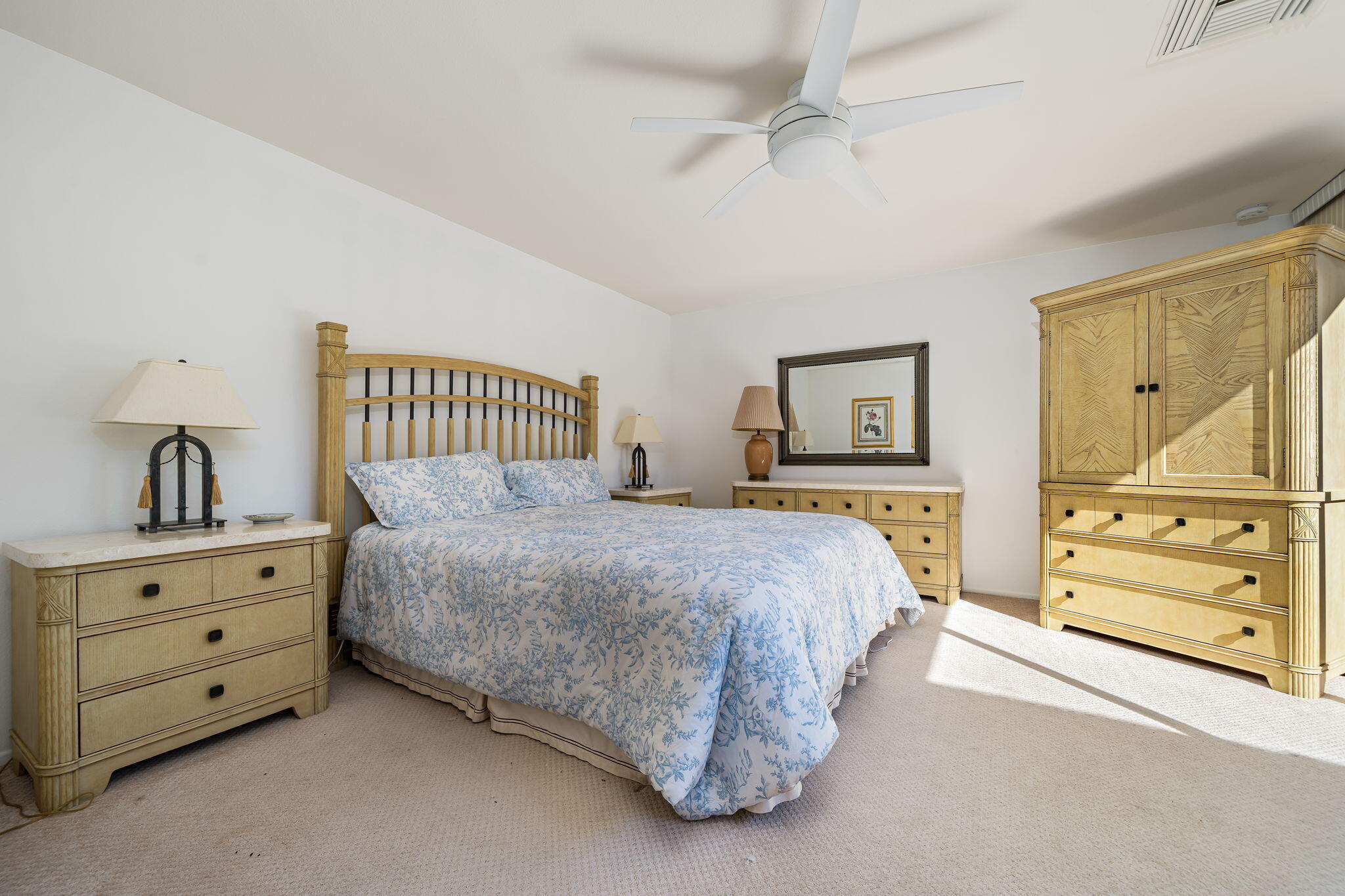 13 Duke Drive Rancho Mirage, CA 92270 - Photo 49 of 68 a spacious bedroom with a bed and a dresser