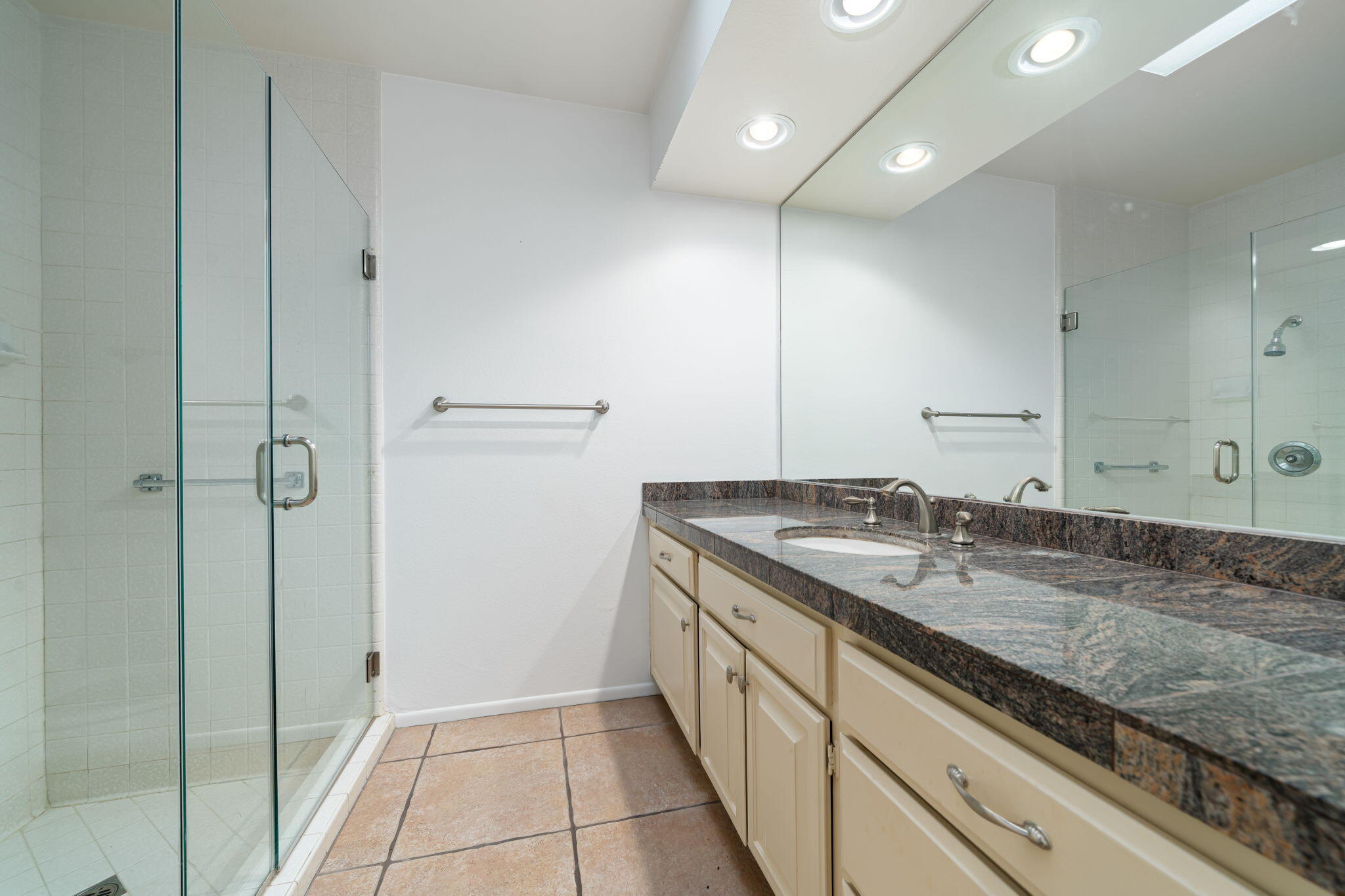 13 Duke Drive Rancho Mirage, CA 92270 - Photo 51 of 68 a bathroom with a granite countertop sink and a mirror