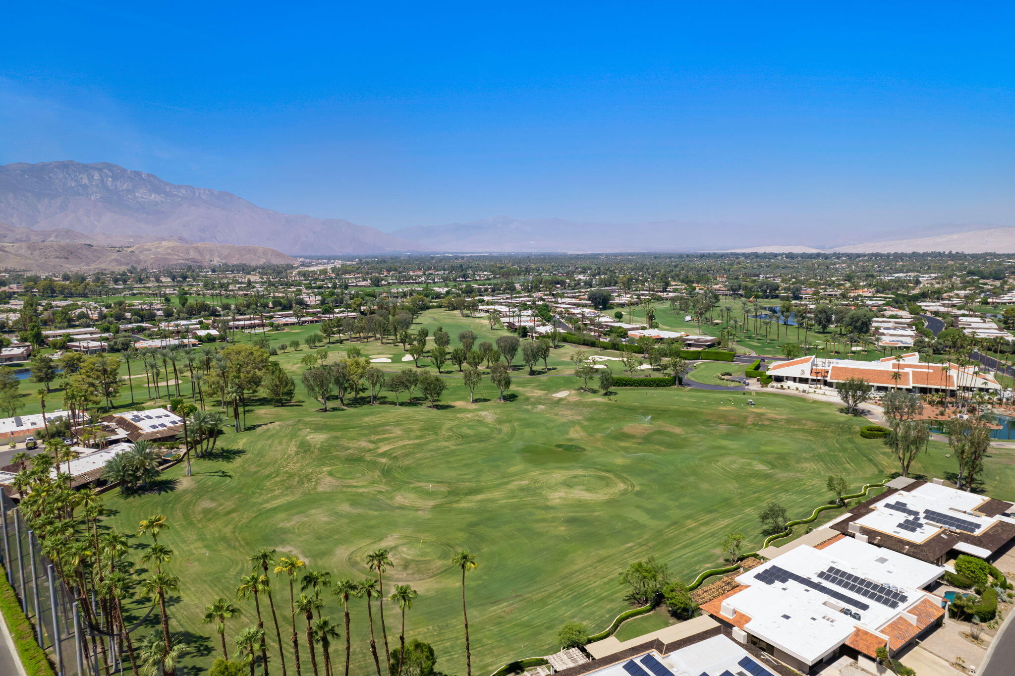 13 Duke Drive Rancho Mirage, CA 92270 - Photo 62 of 68 a view of a lake with a city
