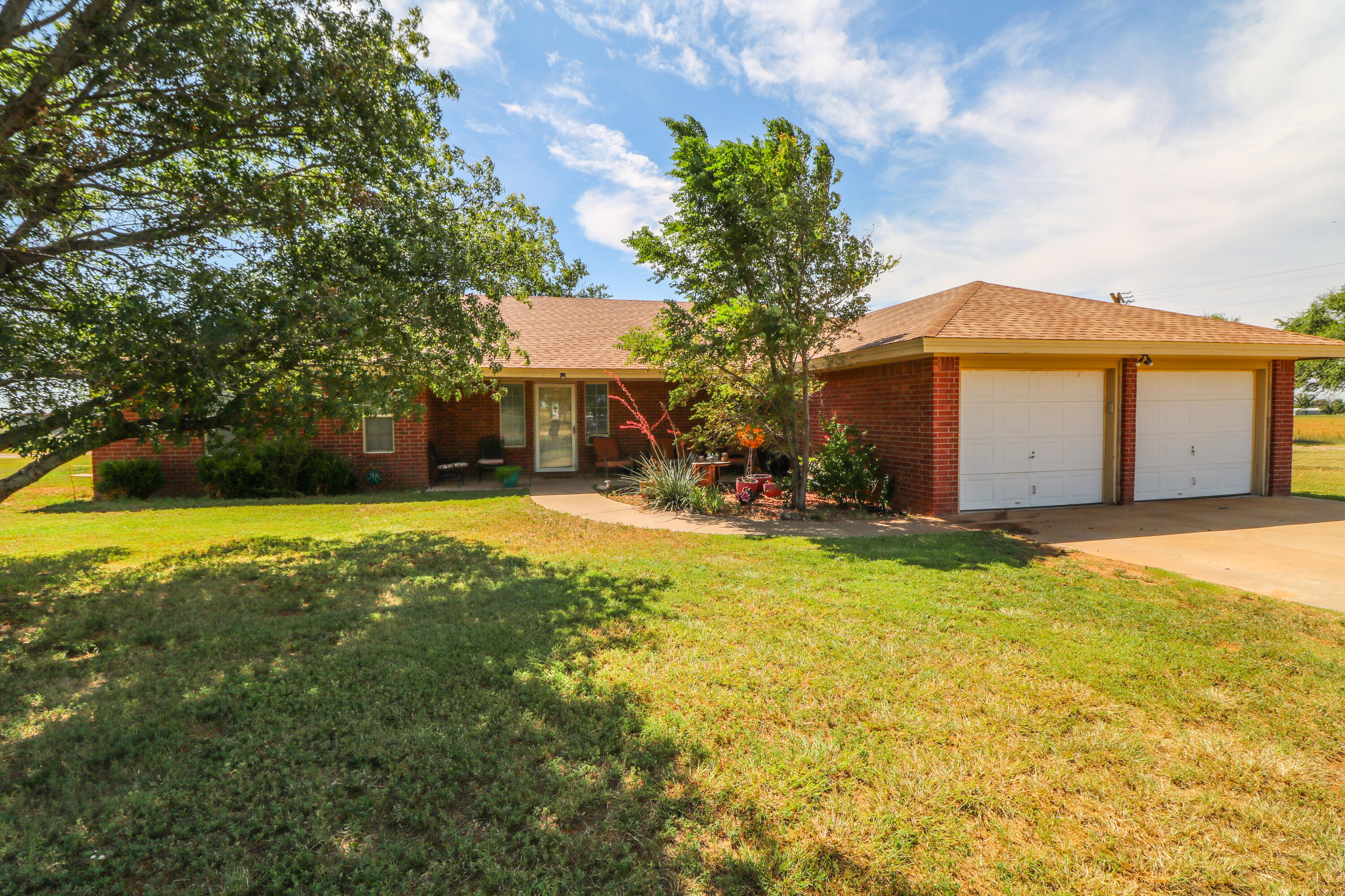 2401 Highway 385, Unit B Littlefield, TX 79339 - Photo 1 of 28 a view of a house with a yard