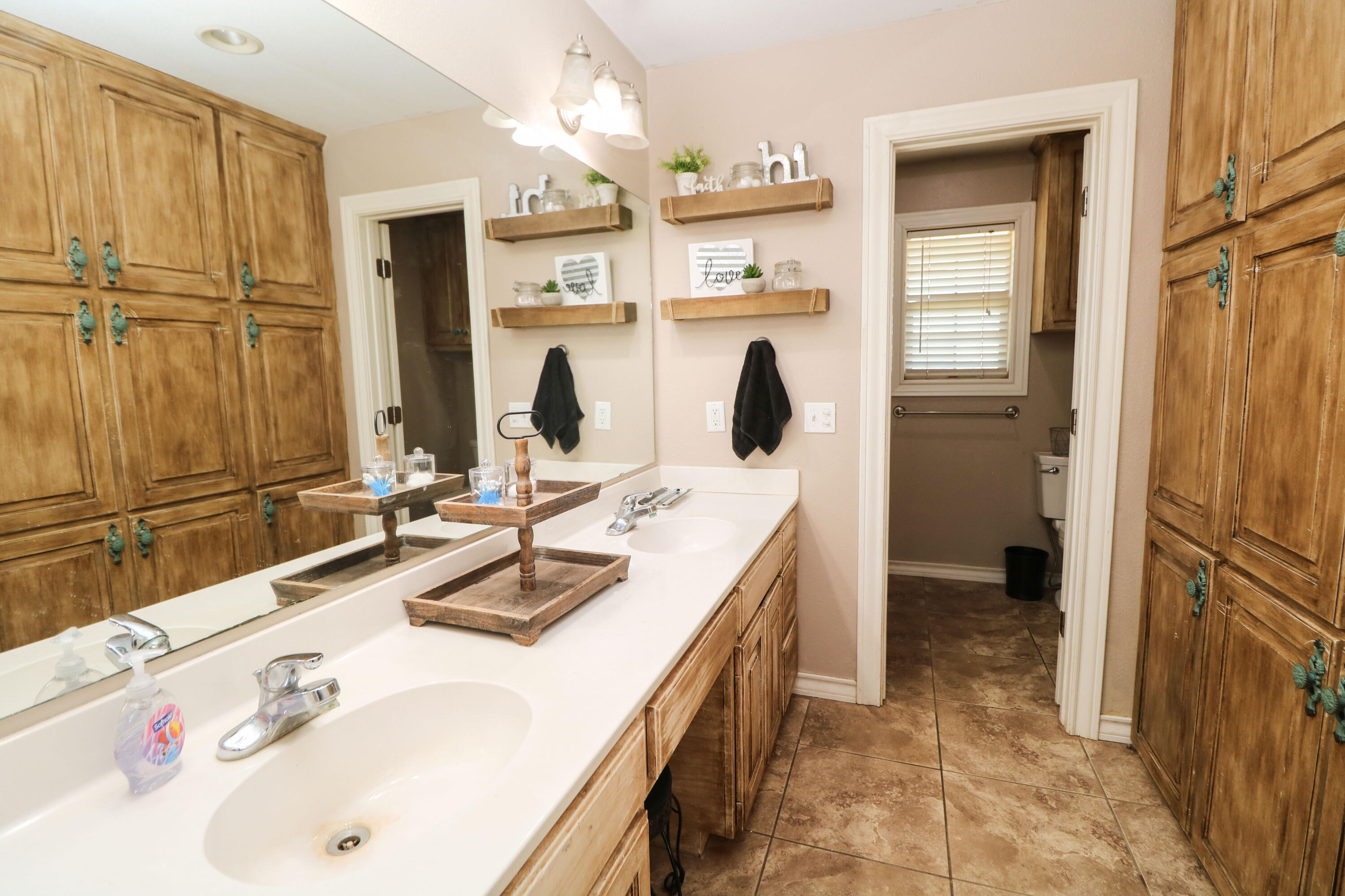 2401 Highway 385, Unit B Littlefield, TX 79339 - Photo 16 of 28 a bathroom with a sink and a mirror