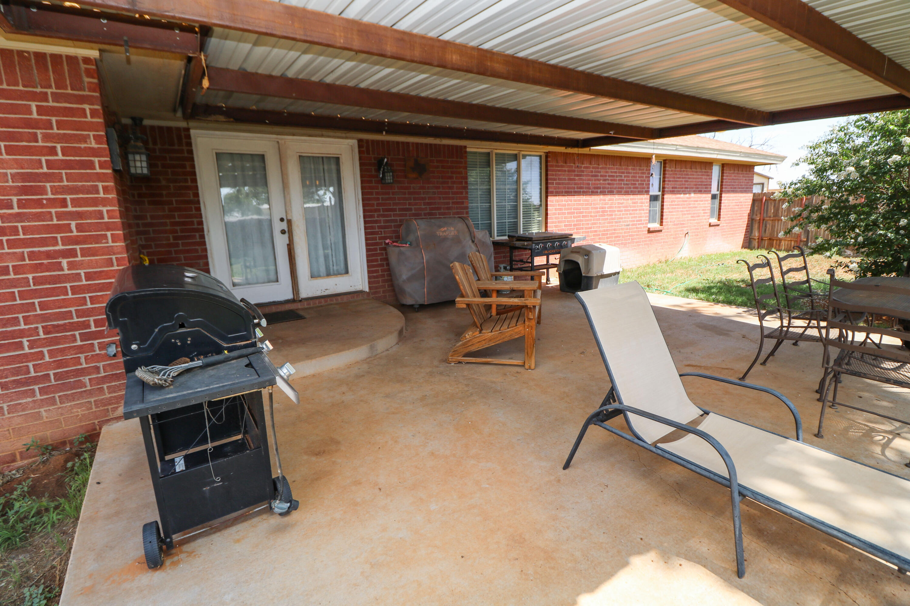 2401 Highway 385, Unit B Littlefield, TX 79339 - Photo 19 of 28 a backyard of a house with table and chairs