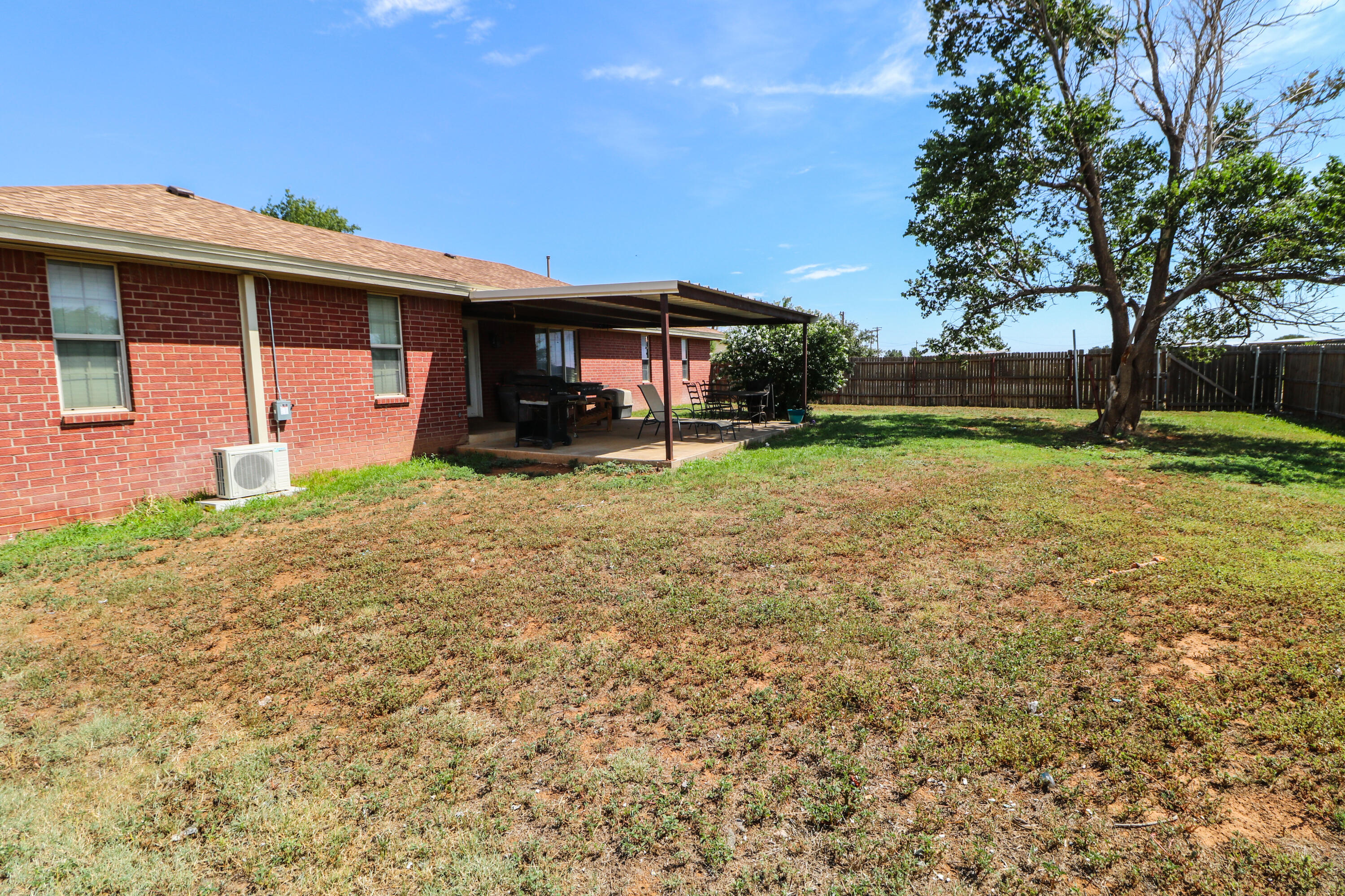 2401 Highway 385, Unit B Littlefield, TX 79339 - Photo 21 of 28 a view of a house with a yard and sitting area