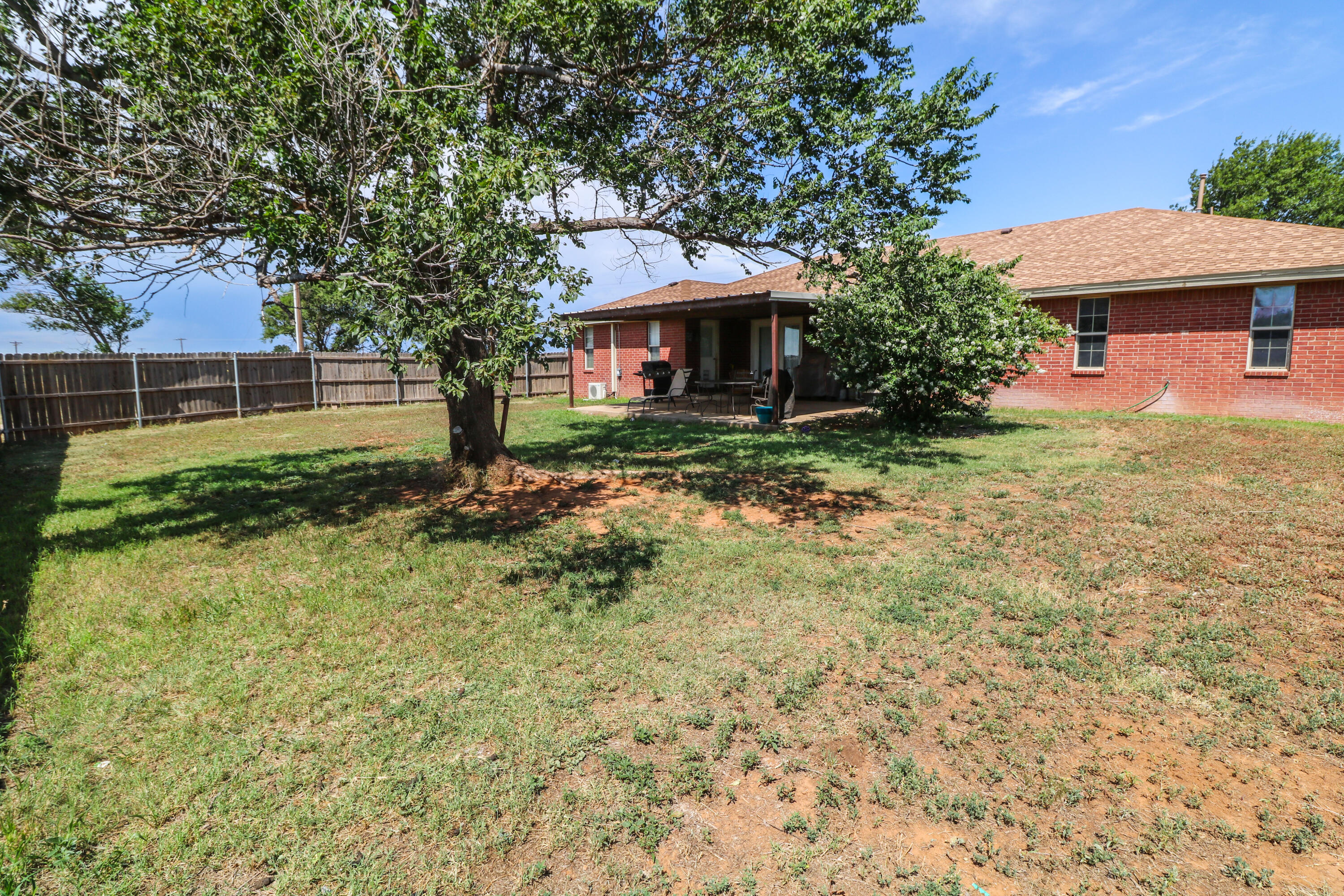 2401 Highway 385, Unit B Littlefield, TX 79339 - Photo 22 of 28 a front view of a house with garden