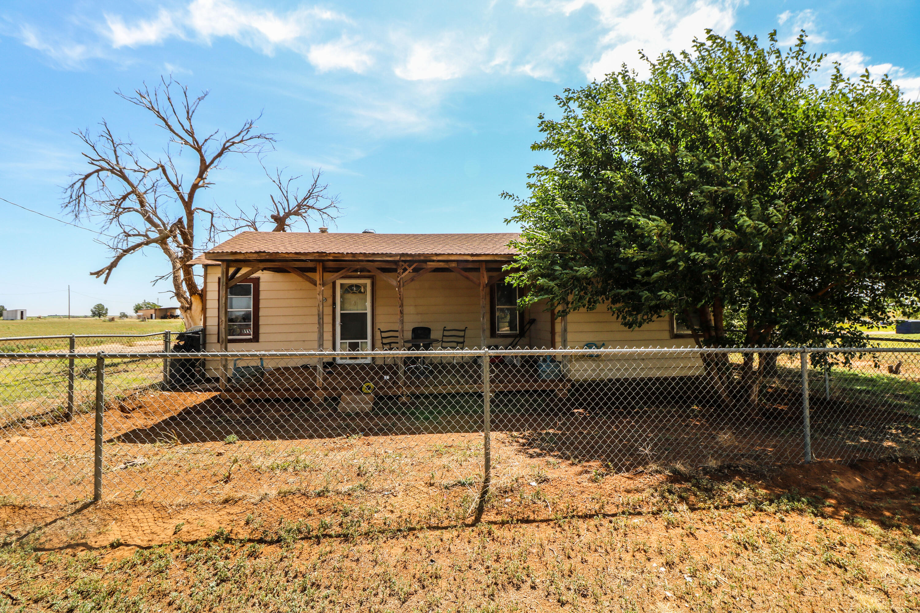 2401 Highway 385, Unit B Littlefield, TX 79339 - Photo 23 of 28 a front view of a house with garden