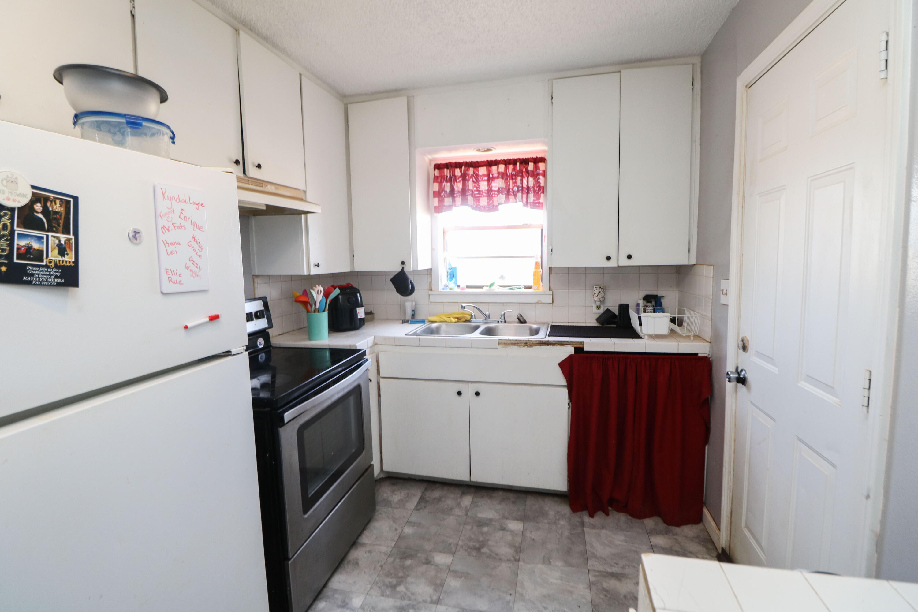 2401 Highway 385, Unit B Littlefield, TX 79339 - Photo 25 of 28 a kitchen with a sink stove and refrigerator
