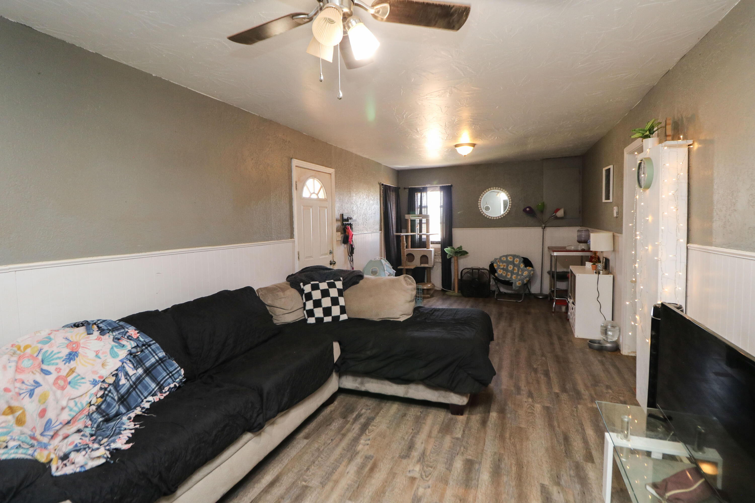 2401 Highway 385, Unit B Littlefield, TX 79339 - Photo 26 of 28 a living room with furniture and a flat screen tv