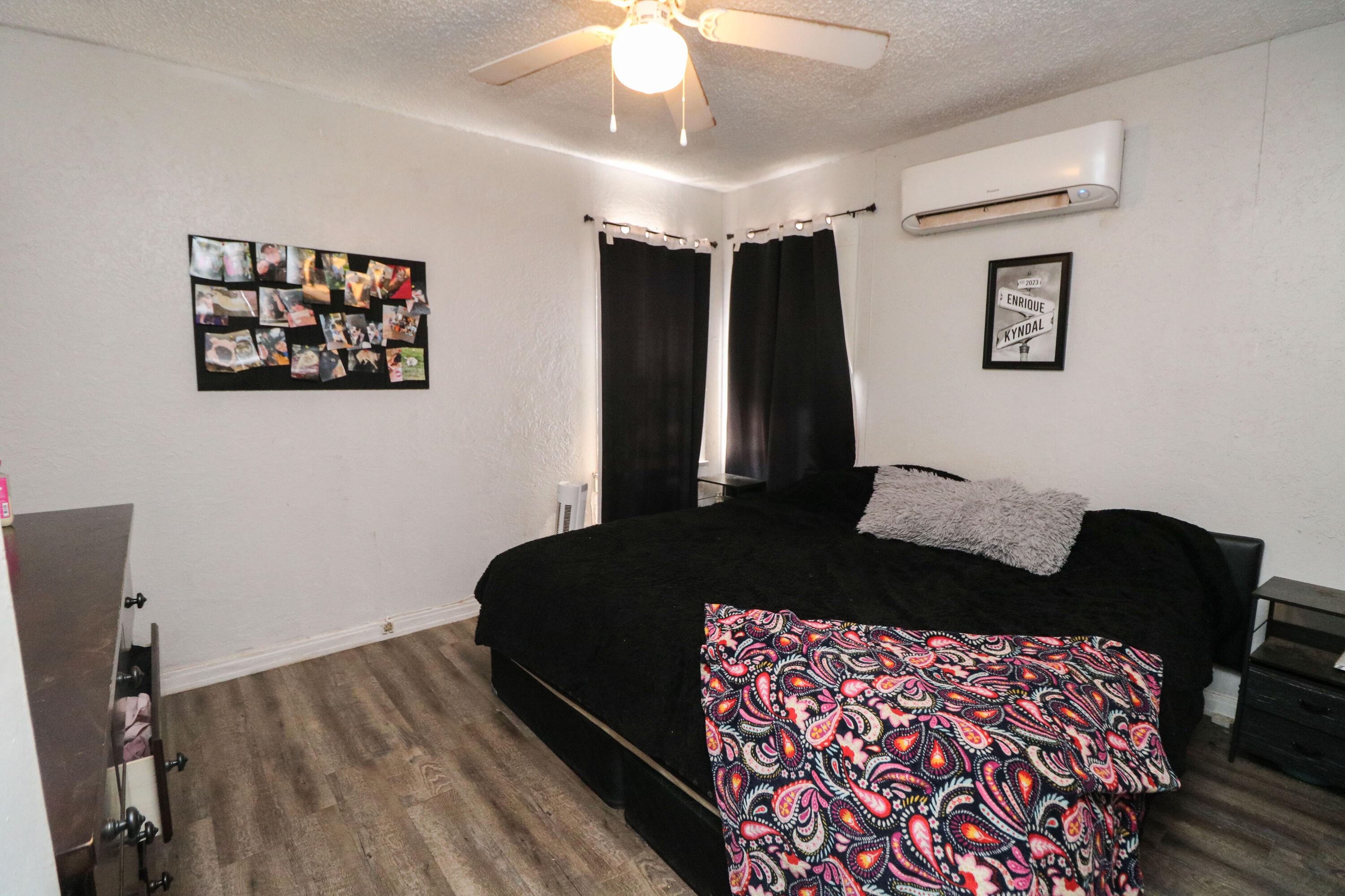 2401 Highway 385, Unit B Littlefield, TX 79339 - Photo 27 of 28 a bedroom with a bed and a chandelier