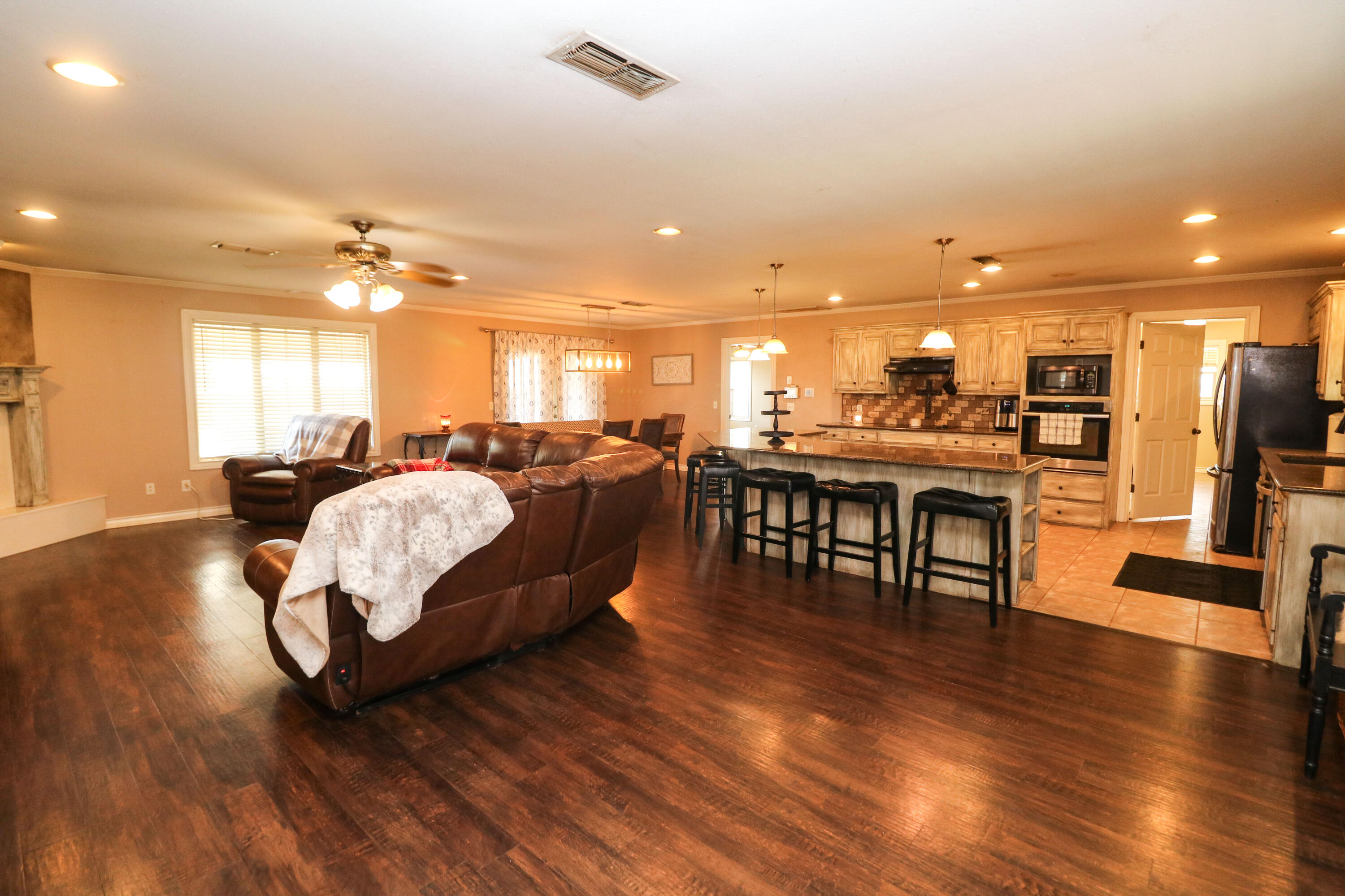 2401 Highway 385, Unit B Littlefield, TX 79339 - Photo 5 of 28 a living room with lots of furniture and kitchen view