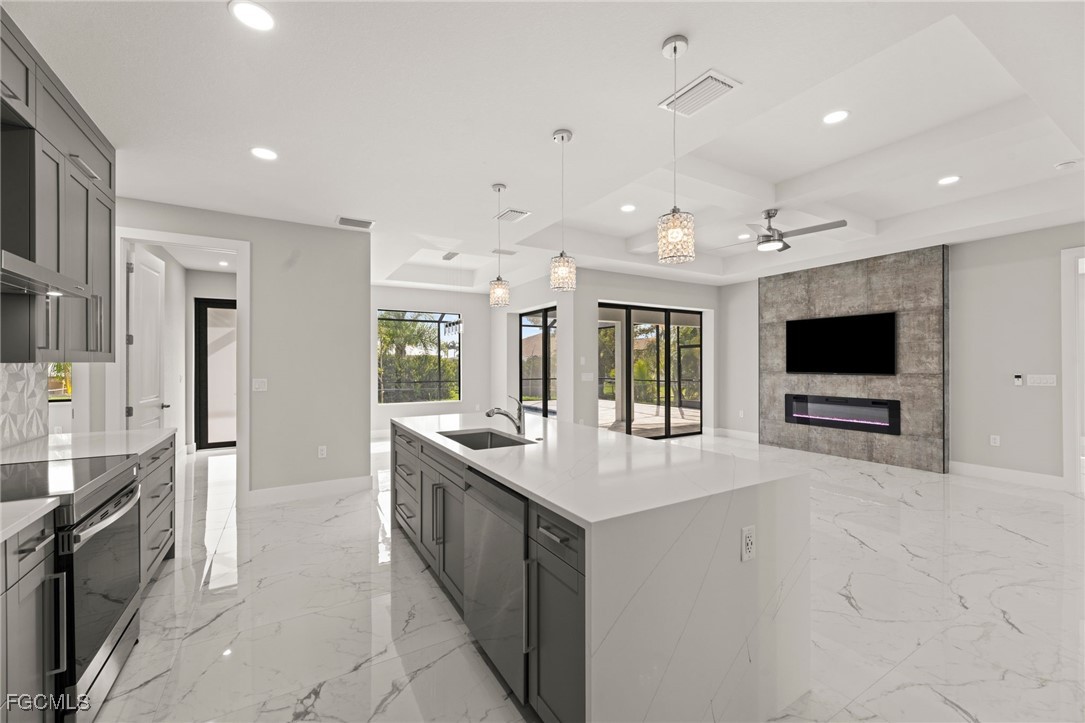 2829 Southwest 25th Place Cape Coral, FL 33914 - Photo 12 of 45 a large white kitchen with a large window