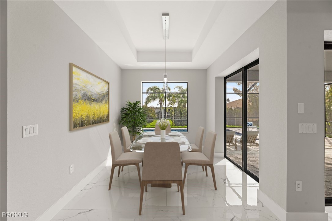 2829 Southwest 25th Place Cape Coral, FL 33914 - Photo 13 of 45 a dining room with furniture and window