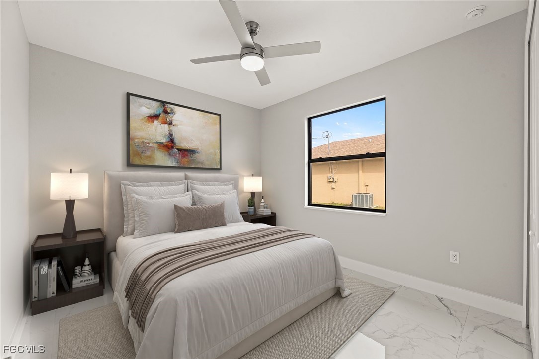 2829 Southwest 25th Place Cape Coral, FL 33914 - Photo 22 of 45 a bedroom with a bed and a painting on the wall