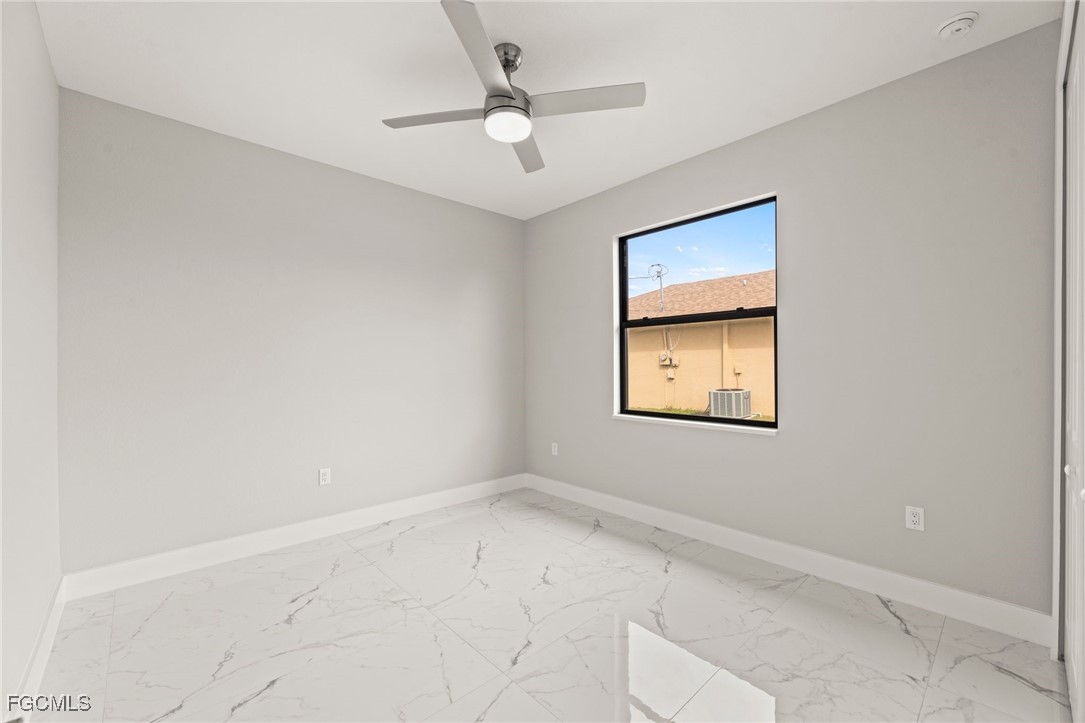 2829 Southwest 25th Place Cape Coral, FL 33914 - Photo 23 of 45 an empty room with a window and a ceiling fan