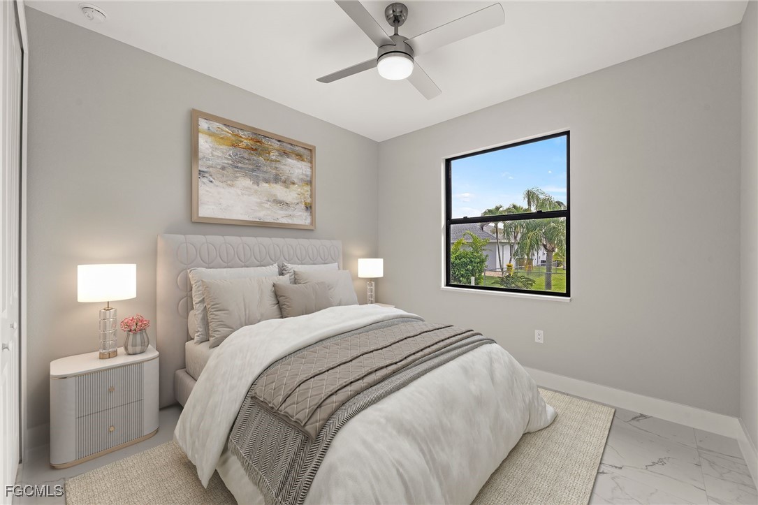 2829 Southwest 25th Place Cape Coral, FL 33914 - Photo 24 of 45 a bedroom with a bed and a painting on the wall