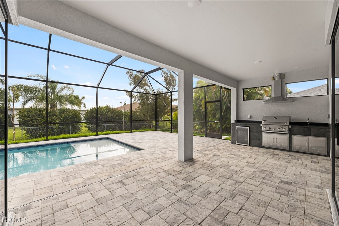 2829 Southwest 25th Place Cape Coral, FL 33914 - Photo 29 of 45 a view of a kitchen with a sink and chandelier
