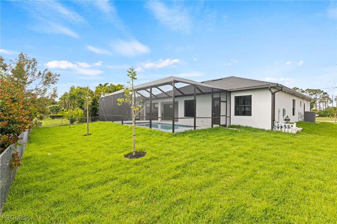 2829 Southwest 25th Place Cape Coral, FL 33914 - Photo 37 of 45 a view of a house with a big yard