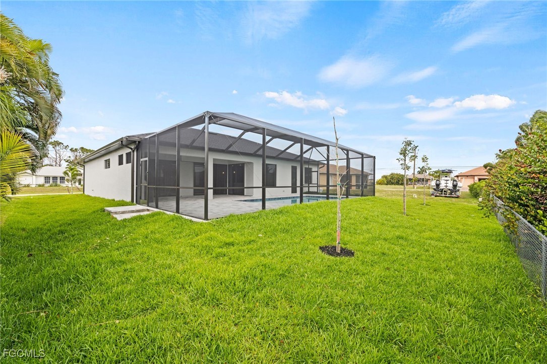 2829 Southwest 25th Place Cape Coral, FL 33914 - Photo 38 of 45 a view of a house with a backyard