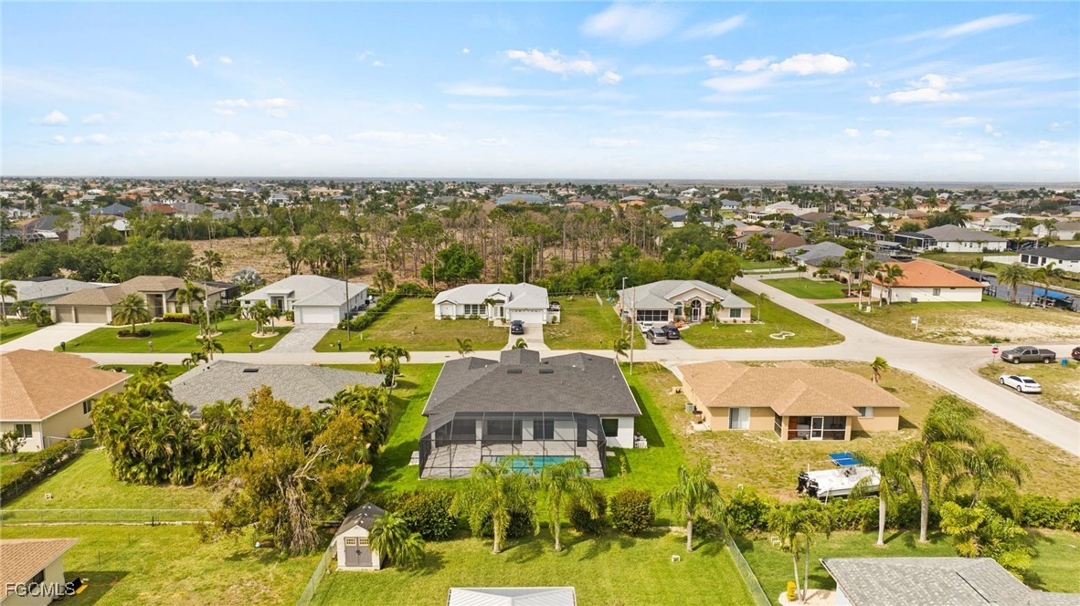 2829 Southwest 25th Place Cape Coral, FL 33914 - Photo 43 of 45 an aerial view of residential houses with outdoor space and swimming pool