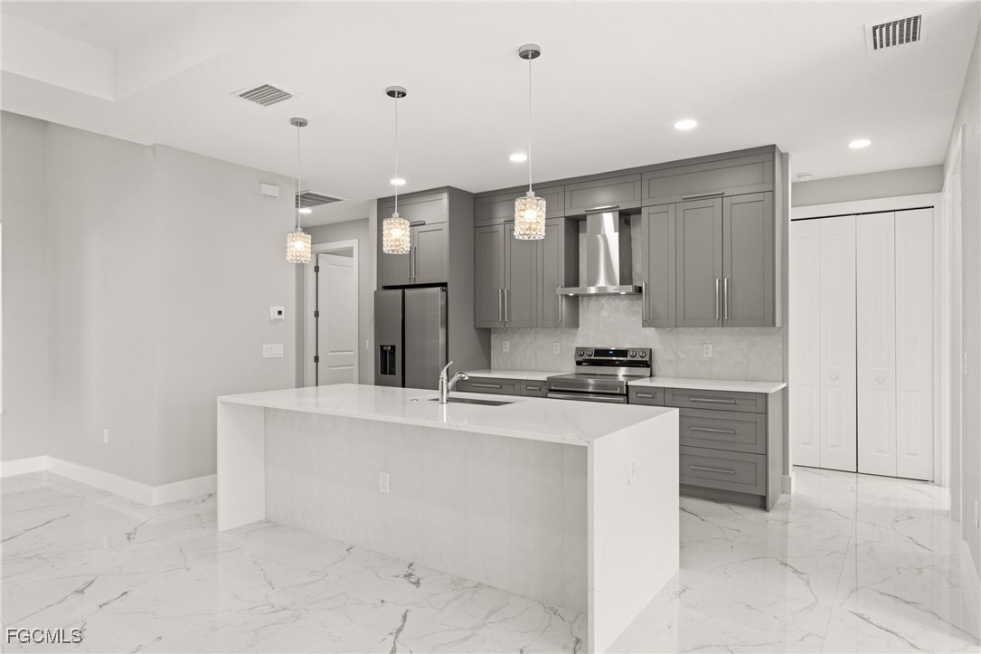 2829 Southwest 25th Place Cape Coral, FL 33914 - Photo 10 of 45 a large white kitchen with a sink and dishwasher