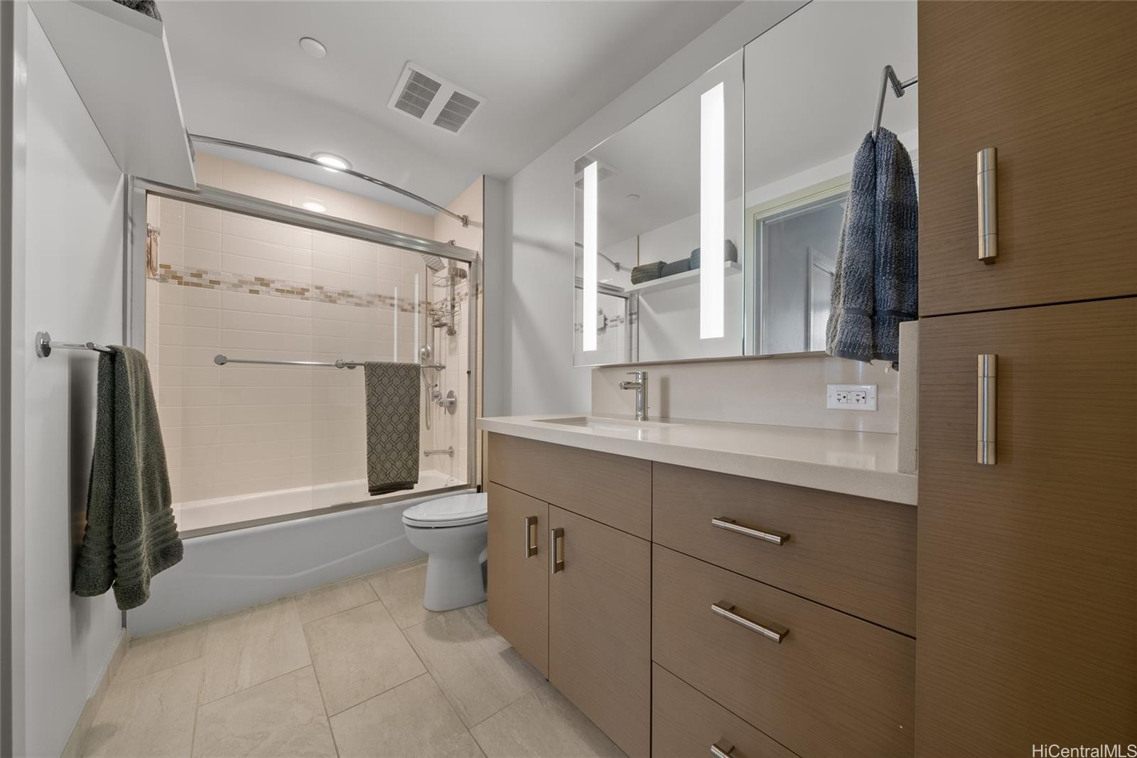 555 South Street, Unit 4202 Honolulu, HI 96813 - Photo 12 of 22 a bathroom with a double vanity sink toilet and shower