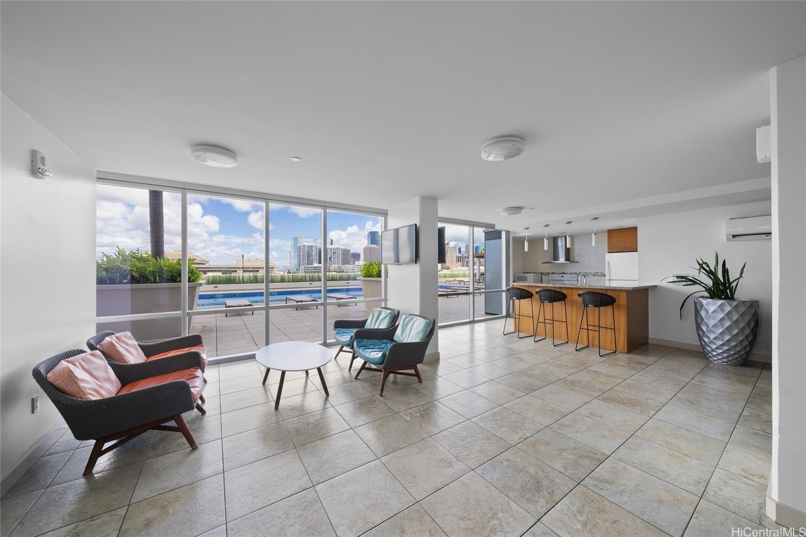 555 South Street, Unit 4202 Honolulu, HI 96813 - Photo 17 of 22 a living room with furniture and a dining table with kitchen view