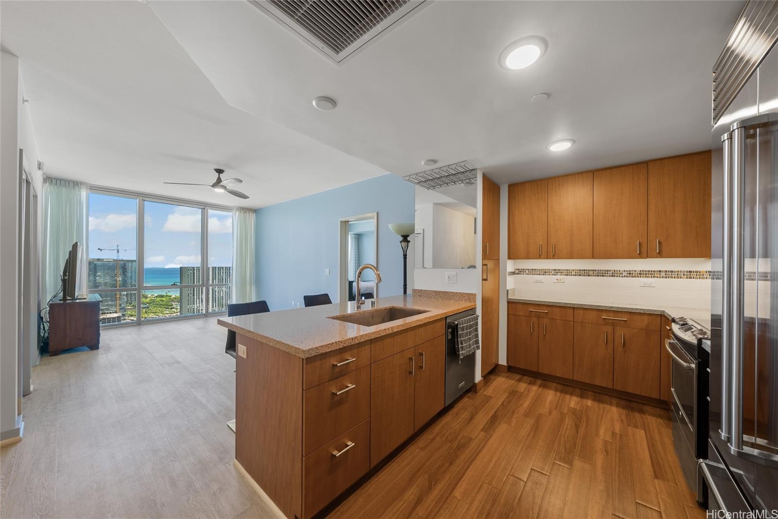 555 South Street, Unit 4202 Honolulu, HI 96813 - Photo 6 of 22 a view of a kitchen with a sink and wooden floor