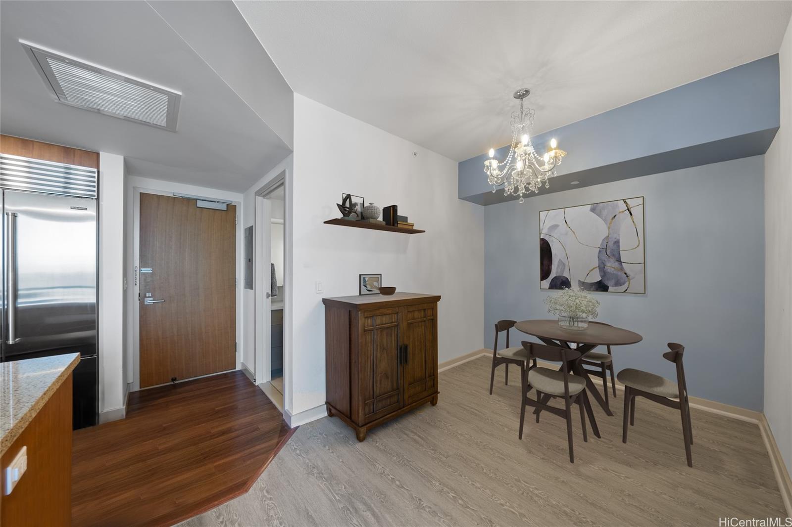 555 South Street, Unit 4202 Honolulu, HI 96813 - Photo 7 of 22 a view of a dining room with furniture and chandelier