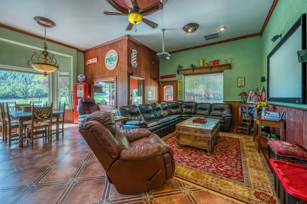 a kitchen with a sink and a view of living room