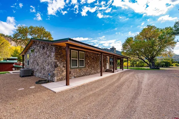 a front view of a house with garage
