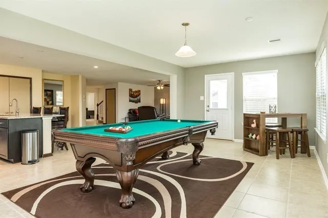 a room with gym equipment and view of living room