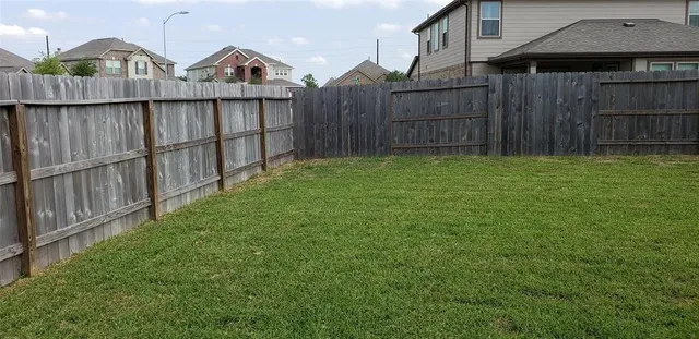 a view of a wooden fence
