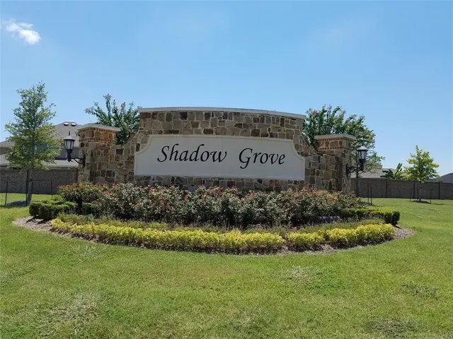 a sign that is sitting in the grass