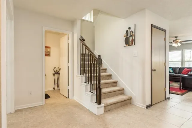 a view of a hallway with closet and a livingroom view