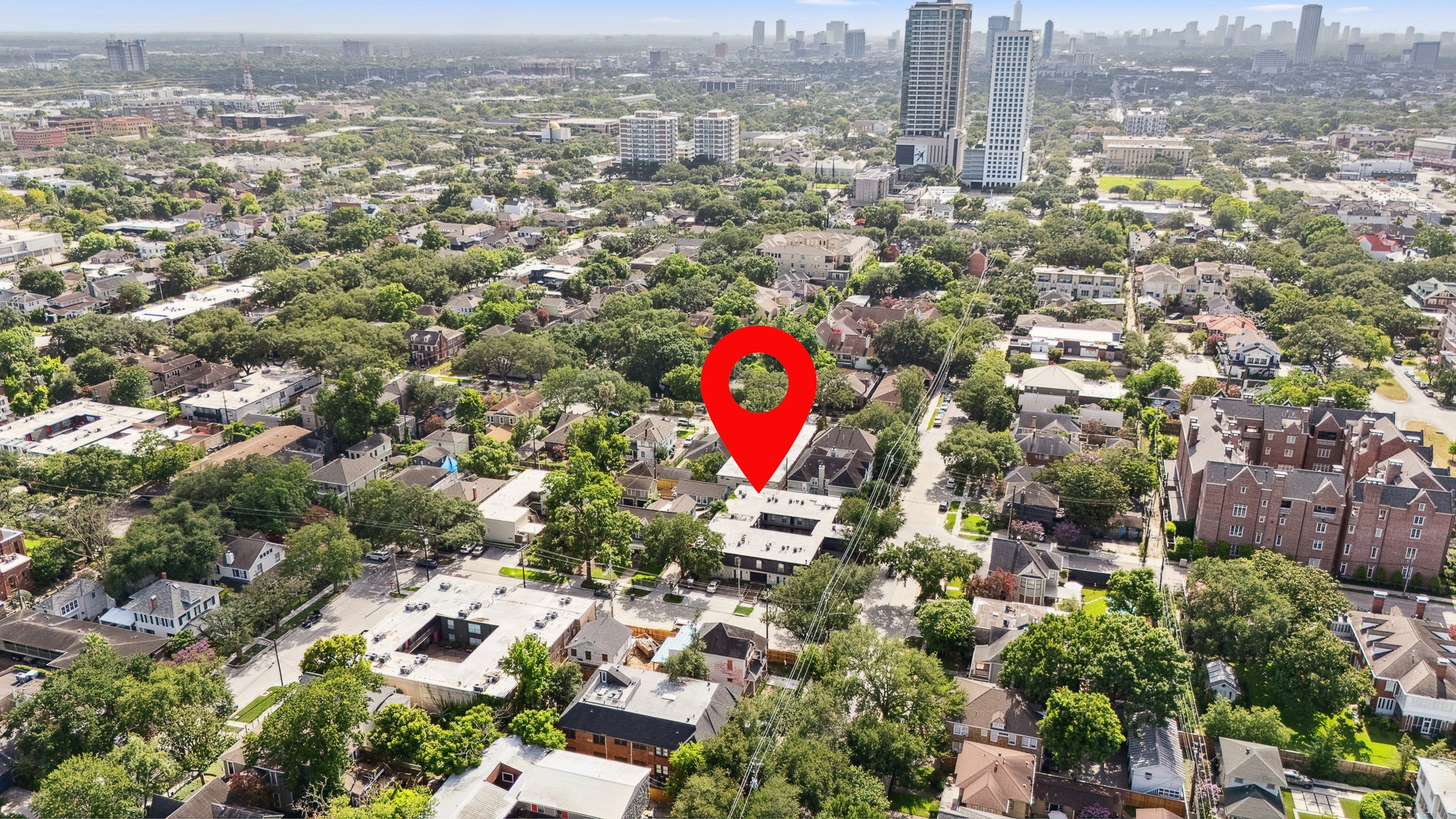 3402 Garrott Street, Unit 15 Houston, TX 77006 - Photo 16 of 17 an aerial view of residential building and parking space