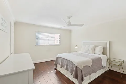 a bedroom with a bed and a table in it