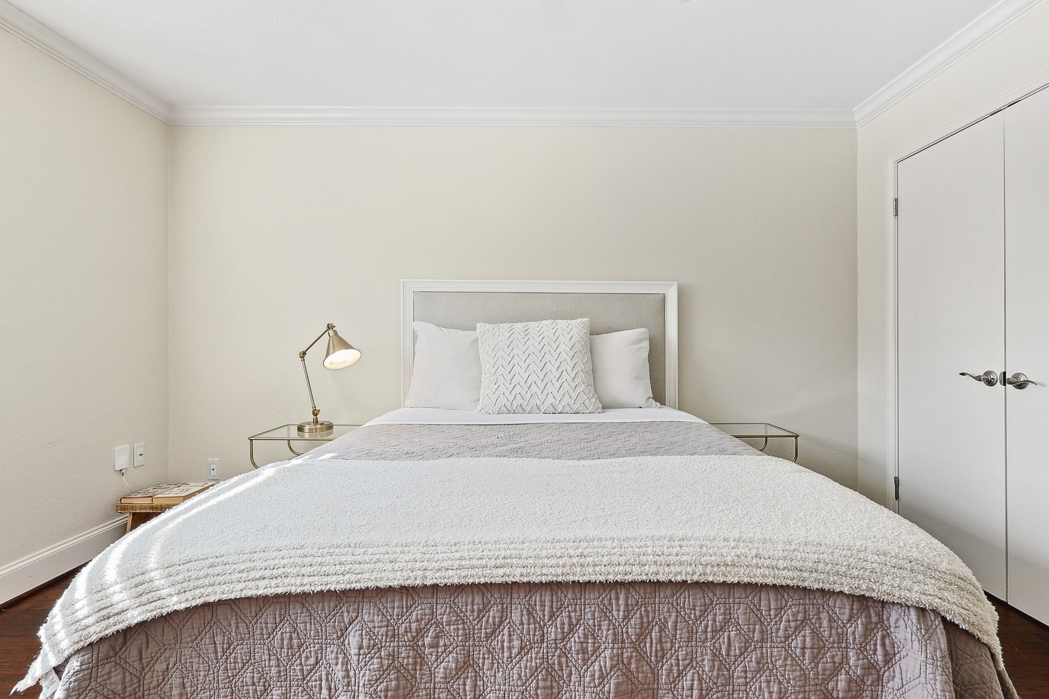 3402 Garrott Street, Unit 15 Houston, TX 77006 - Photo 5 of 17 a bedroom with a bed and a night stand