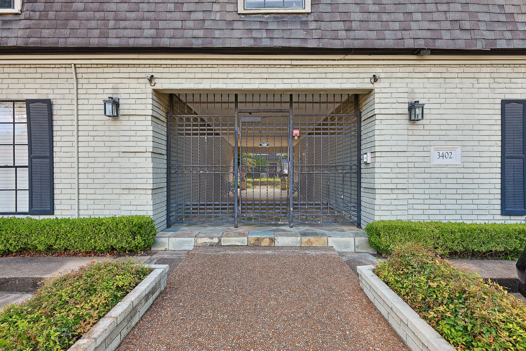3402 Garrott Street, Unit 15 Houston, TX 77006 - Photo 10 of 17 a front view of a house with garden