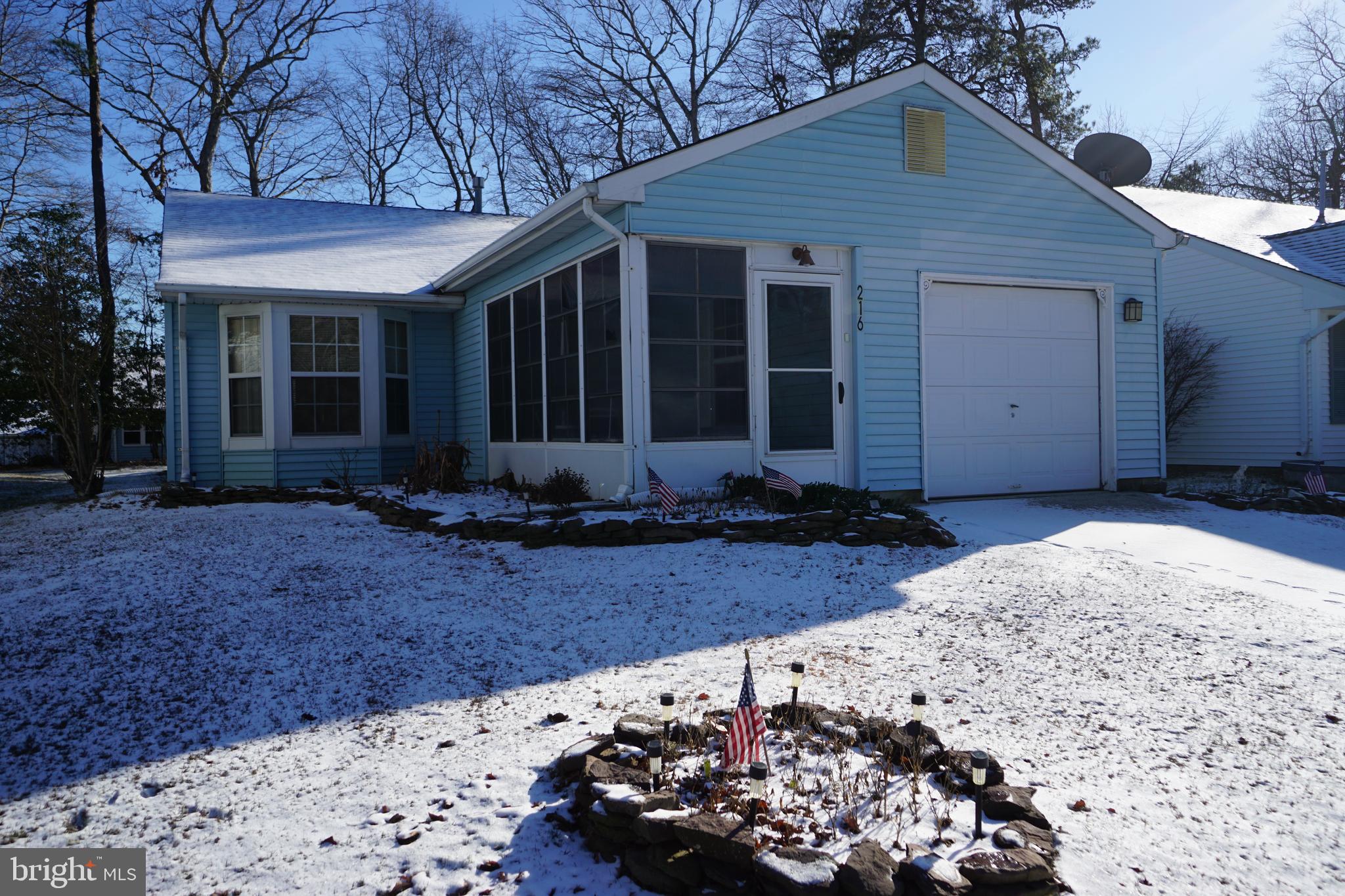 216 Danbury Drive Little Egg Harbor, NJ 08087 - Photo 1 of 19 a front view of a house with garden