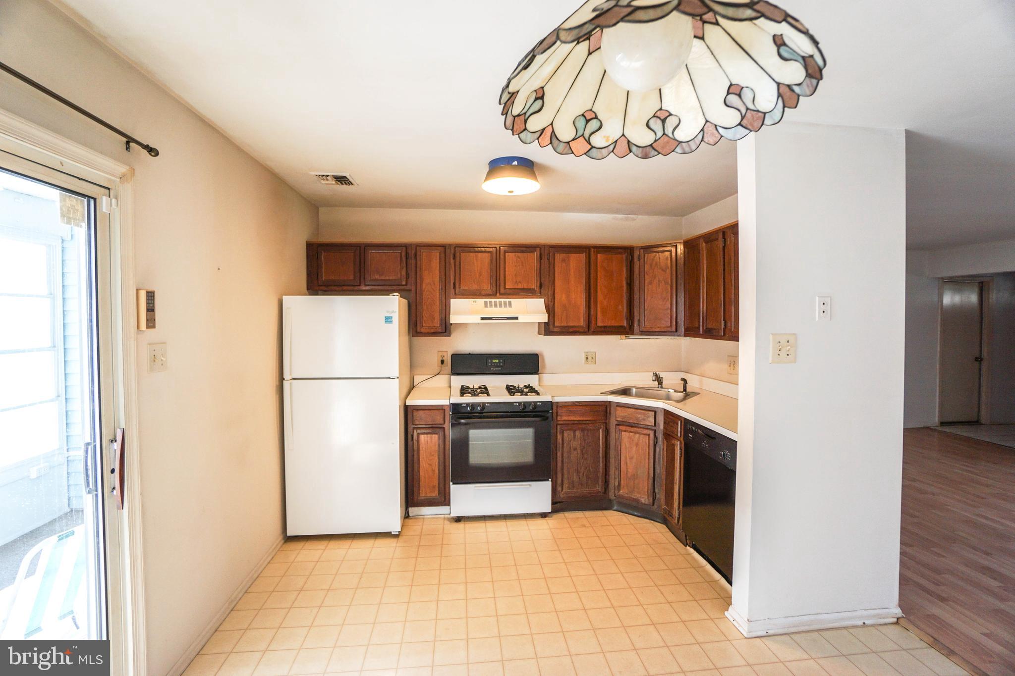 216 Danbury Drive Little Egg Harbor, NJ 08087 - Photo 11 of 19 a kitchen with stainless steel appliances granite countertop a refrigerator and a sink