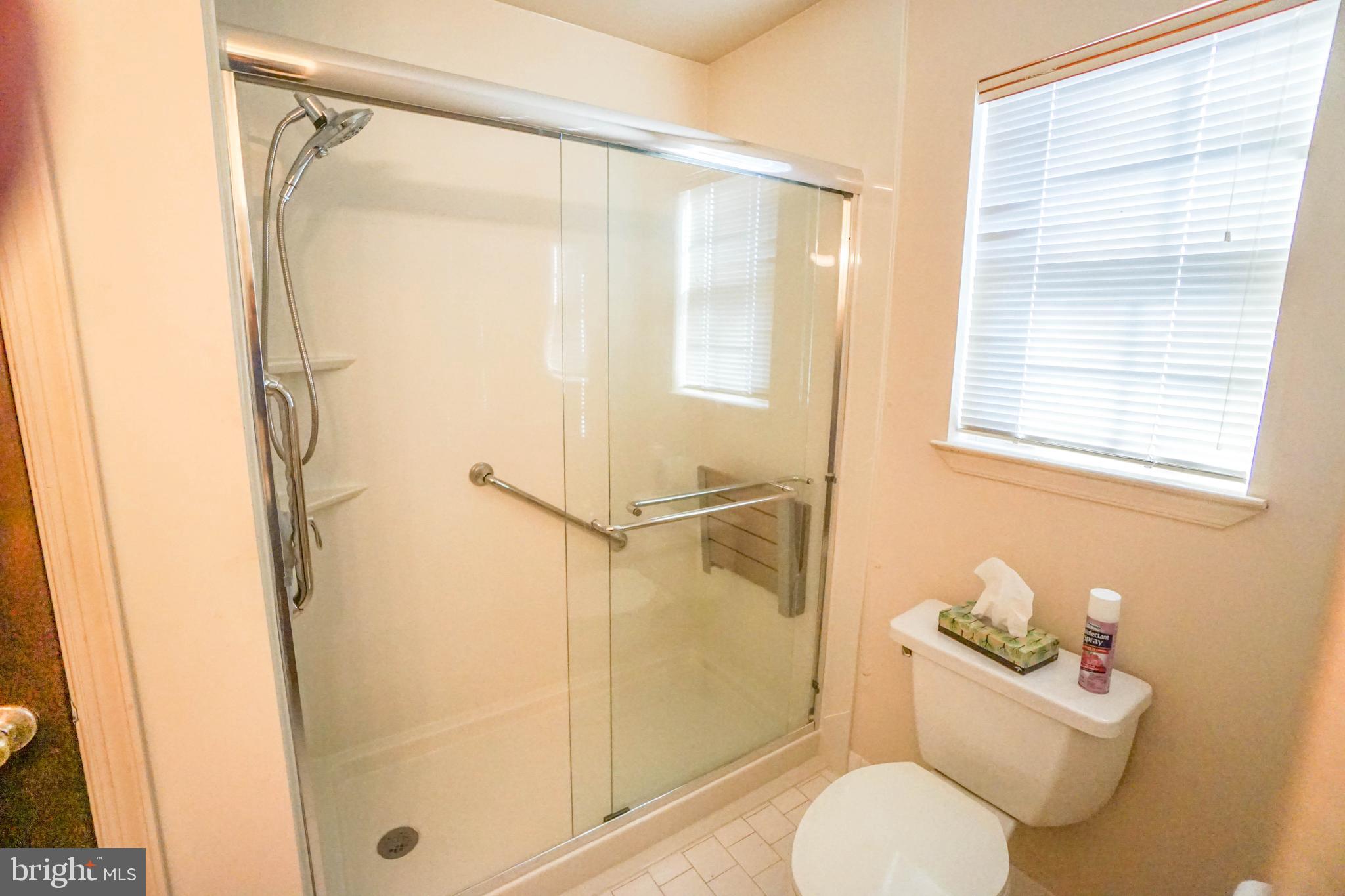 216 Danbury Drive Little Egg Harbor, NJ 08087 - Photo 12 of 19 a bathroom with a toilet and shower