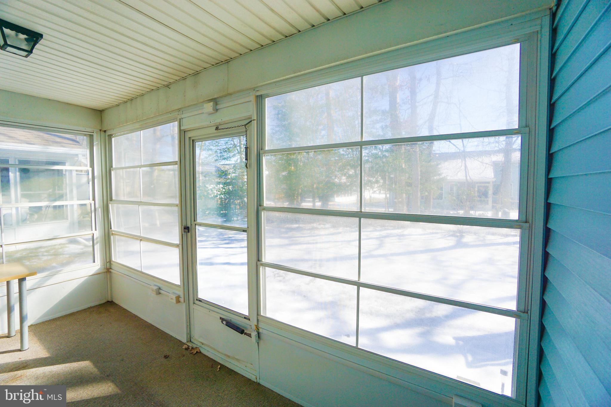 216 Danbury Drive Little Egg Harbor, NJ 08087 - Photo 19 of 19 a view of a glass door with a balcony