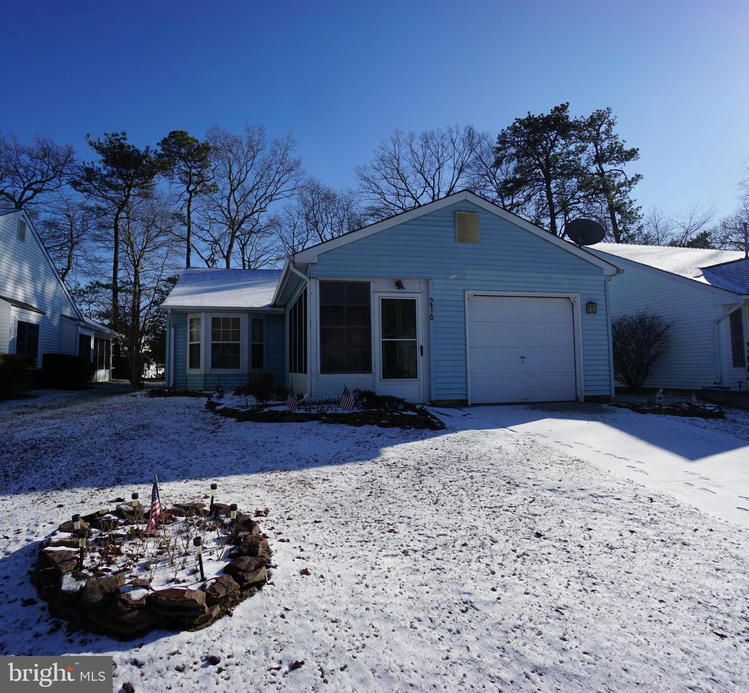 216 Danbury Drive Little Egg Harbor, NJ 08087 - Photo 2 of 19 a front view of a house with a yard and garage