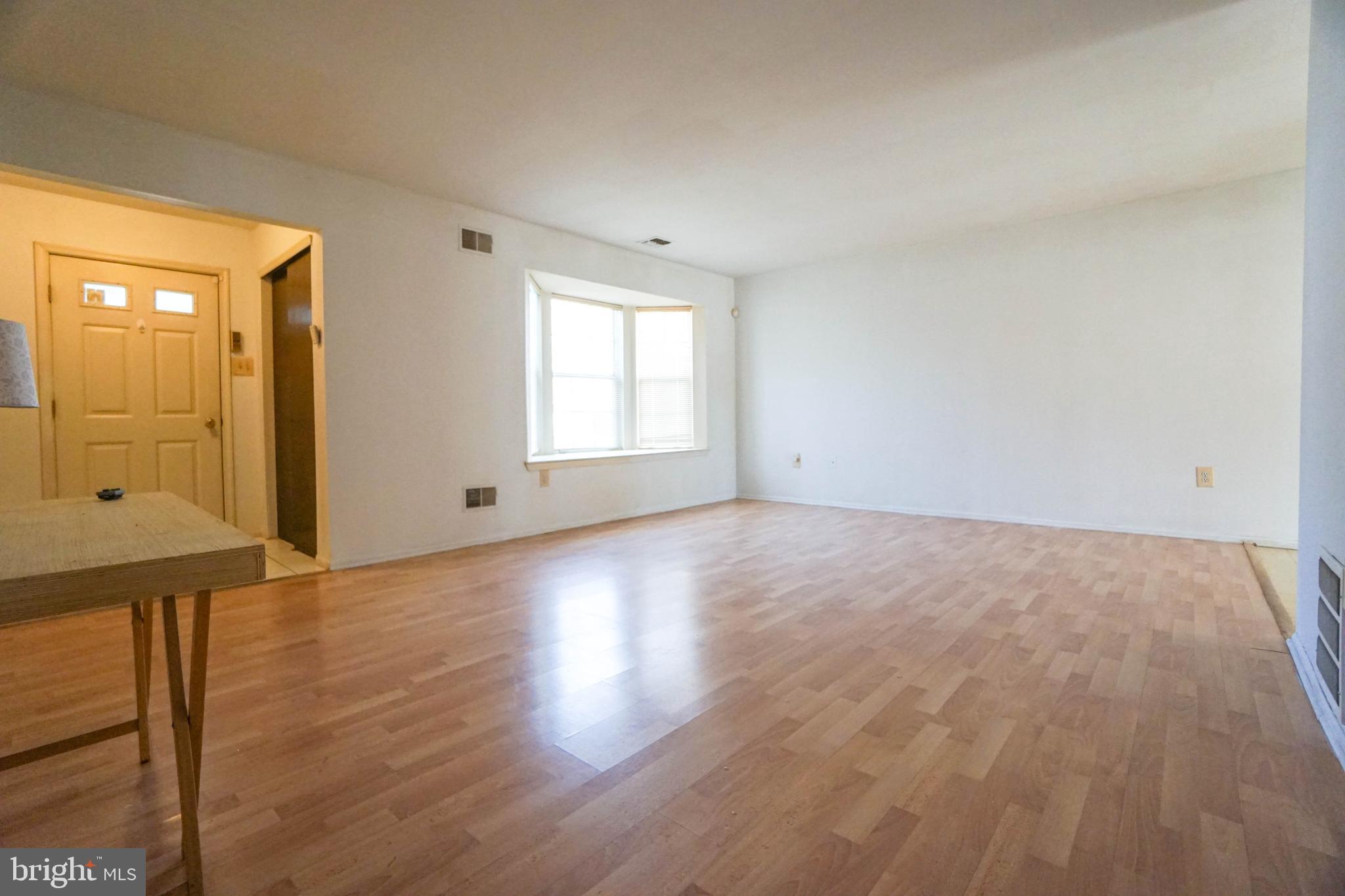 216 Danbury Drive Little Egg Harbor, NJ 08087 - Photo 7 of 19 a view of empty room with wooden floor and fan