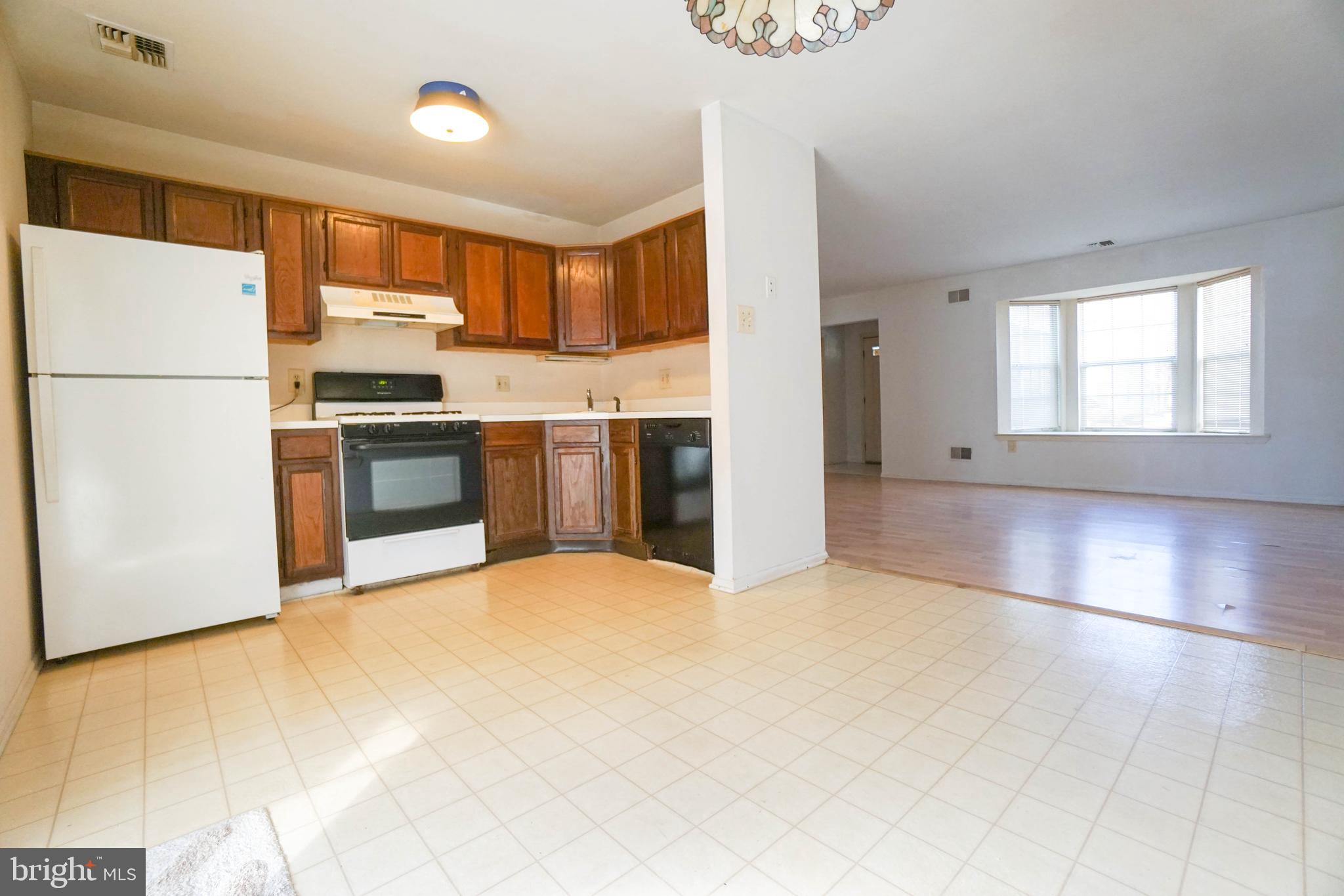 216 Danbury Drive Little Egg Harbor, NJ 08087 - Photo 10 of 19 a large kitchen with stainless steel appliances granite countertop a refrigerator a stove a sink and a white cabinets