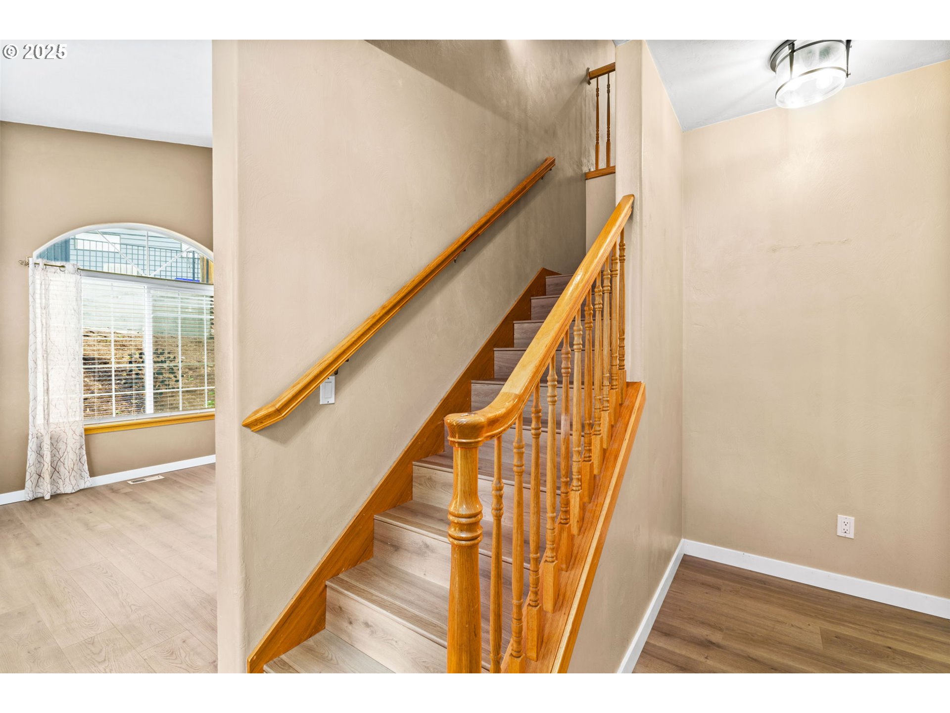 1162 South 69th Street Springfield, OR 97478 - Photo 17 of 37 a view of a hallway with wooden floor and staircase