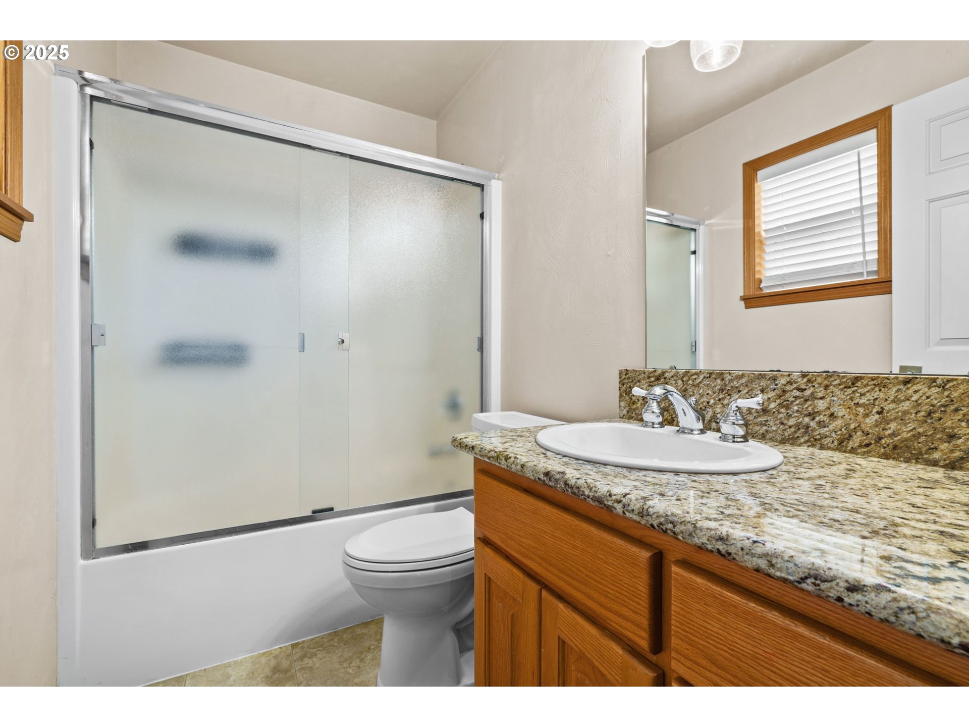 1162 South 69th Street Springfield, OR 97478 - Photo 30 of 37 a bathroom with a granite countertop sink mirror vanity and toilet