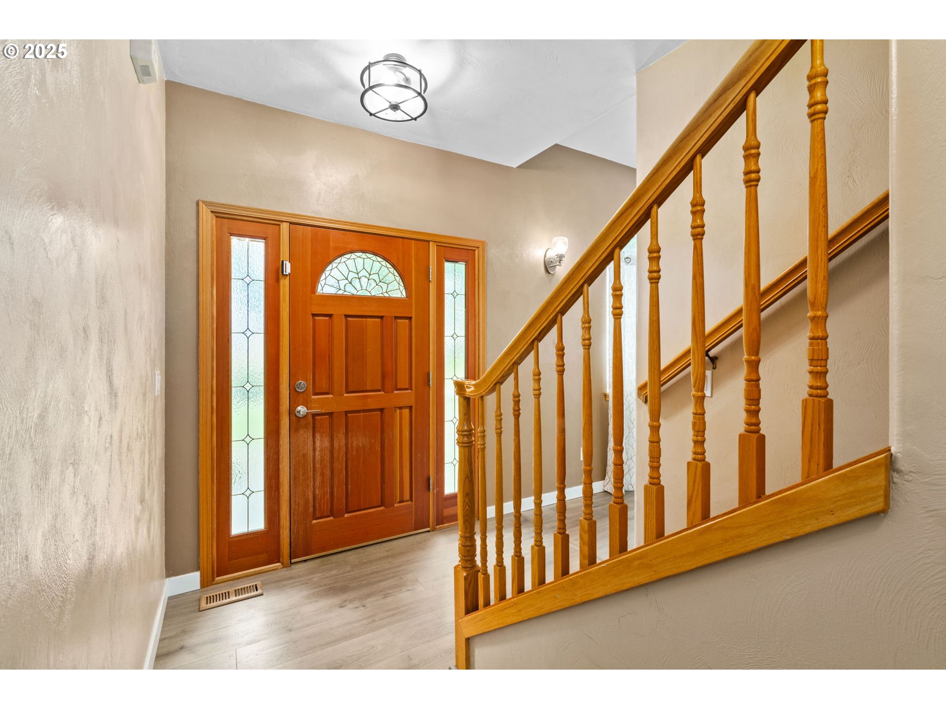 1162 South 69th Street Springfield, OR 97478 - Photo 3 of 37 a view of an entryway with wooden floor