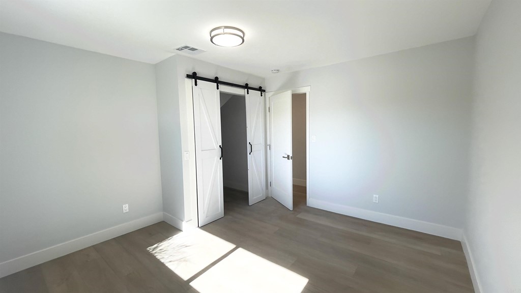 2159 Shire Drive El Cajon, CA 92019 - Photo 11 of 18 an empty room with an entryway and closet