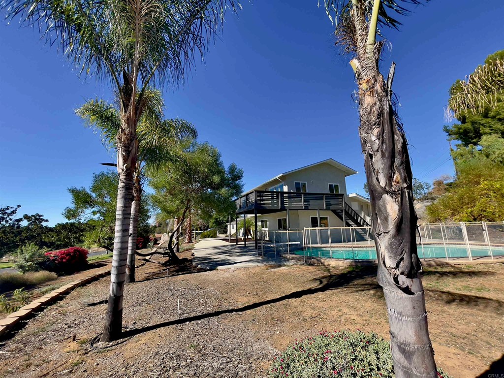2159 Shire Drive El Cajon, CA 92019 - Photo 4 of 18 a house with palm tree in front of it