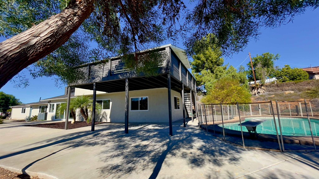 2159 Shire Drive El Cajon, CA 92019 - Photo 6 of 18 a view of a chair and table in backyard